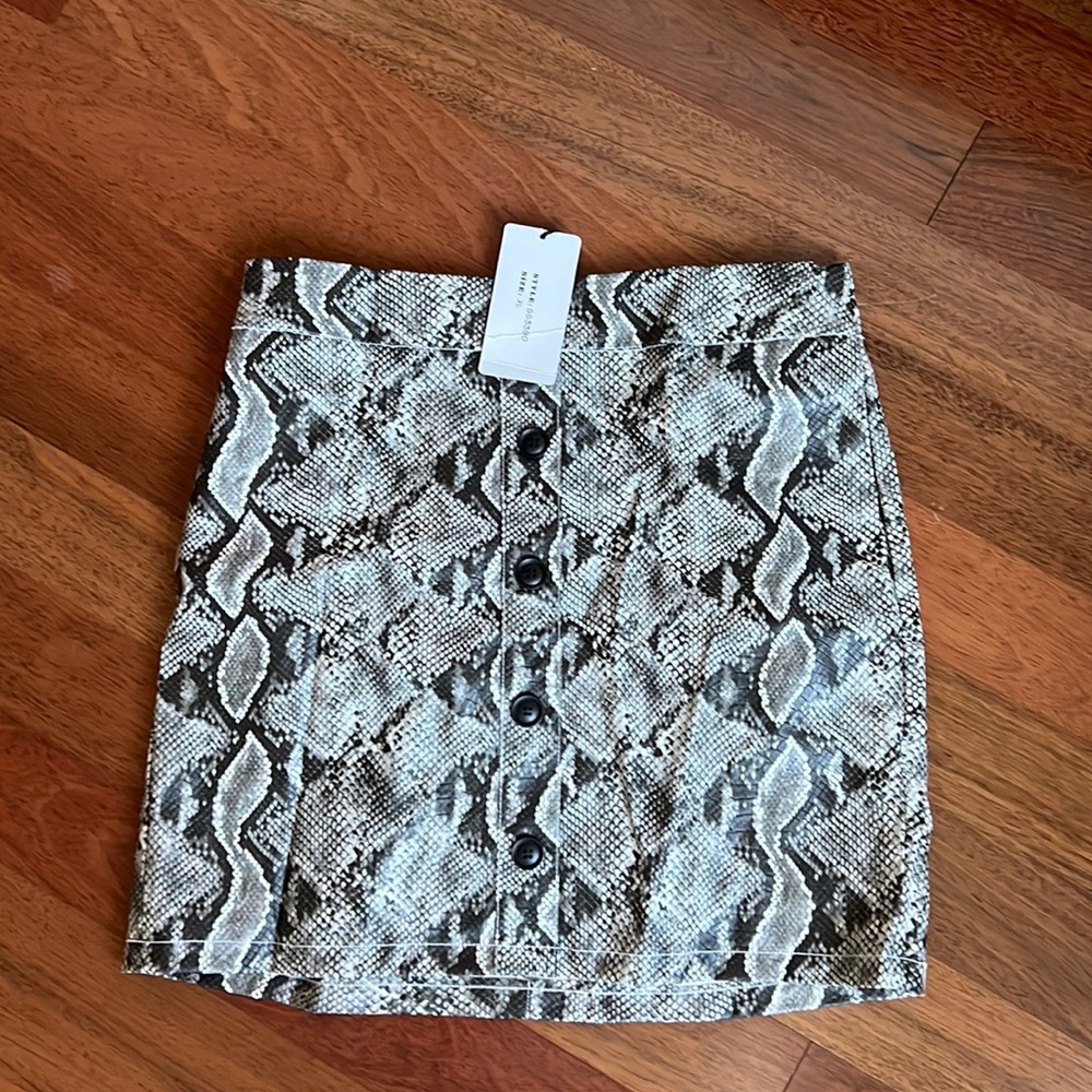 Snake print faux leather skirt